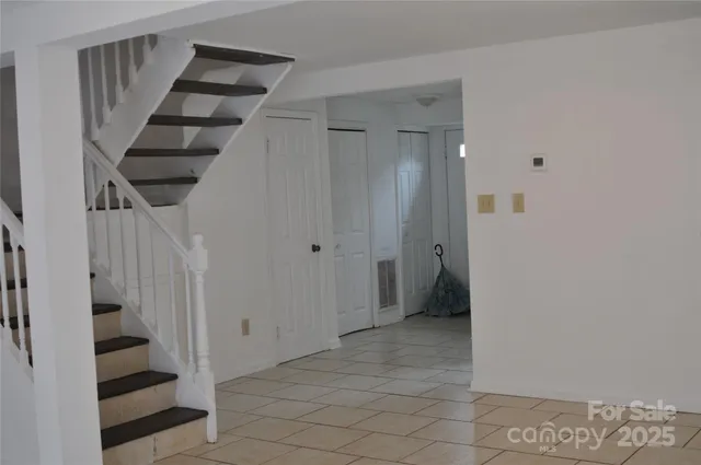 a view of entryway and hall with a front door