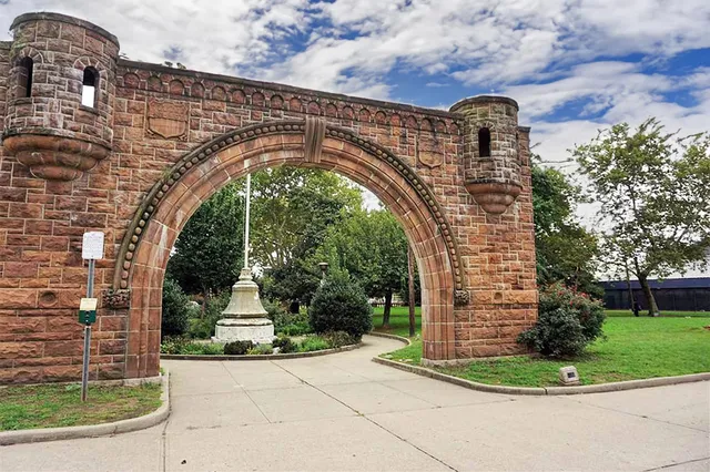 a large building with trees in the background