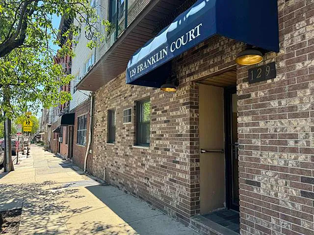 a view of a pathway along the building