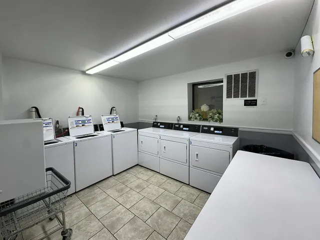 a kitchen with a sink cabinets and window