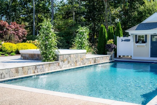 a view of a swimming pool with an outdoor seating