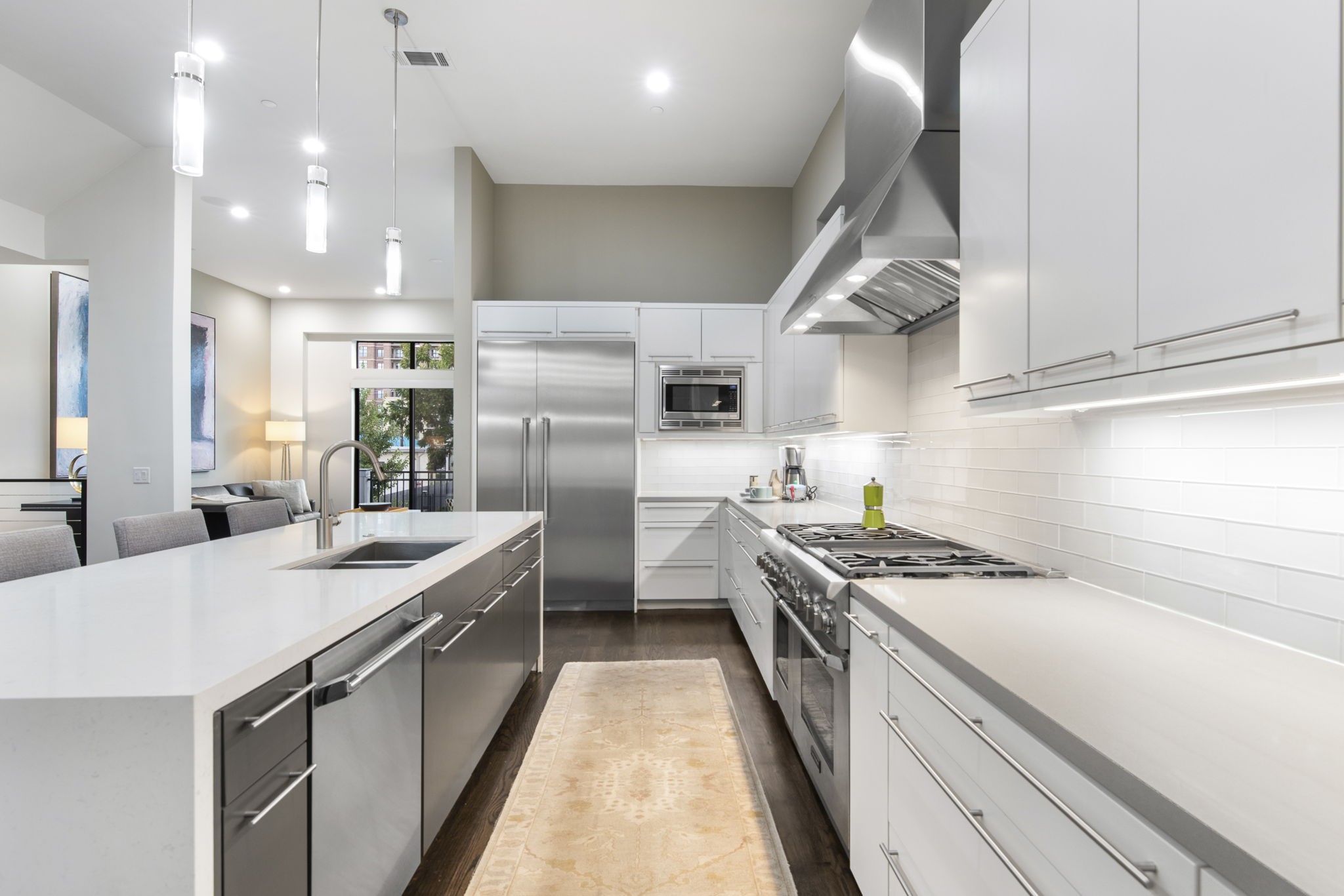 205 Portland Street Houston, TX 77006 - Photo 11 of 36 a kitchen with stainless steel appliances a sink stove and refrigerator