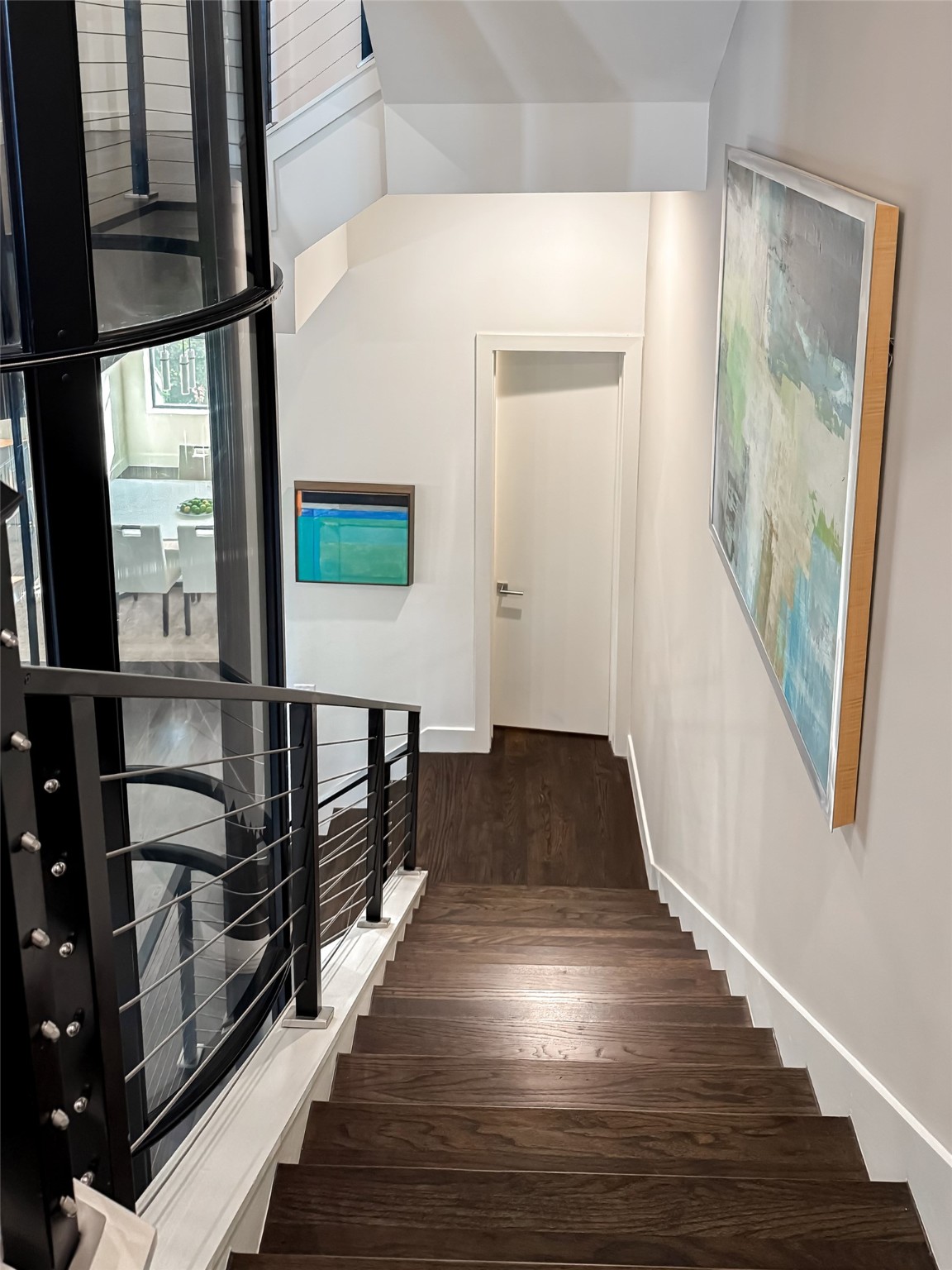205 Portland Street Houston, TX 77006 - Photo 17 of 36 a view of a hallway with wooden floor and staircase