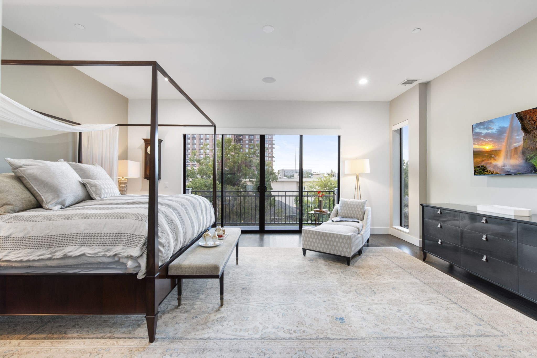 205 Portland Street Houston, TX 77006 - Photo 18 of 36 a bedroom with a bed and large window