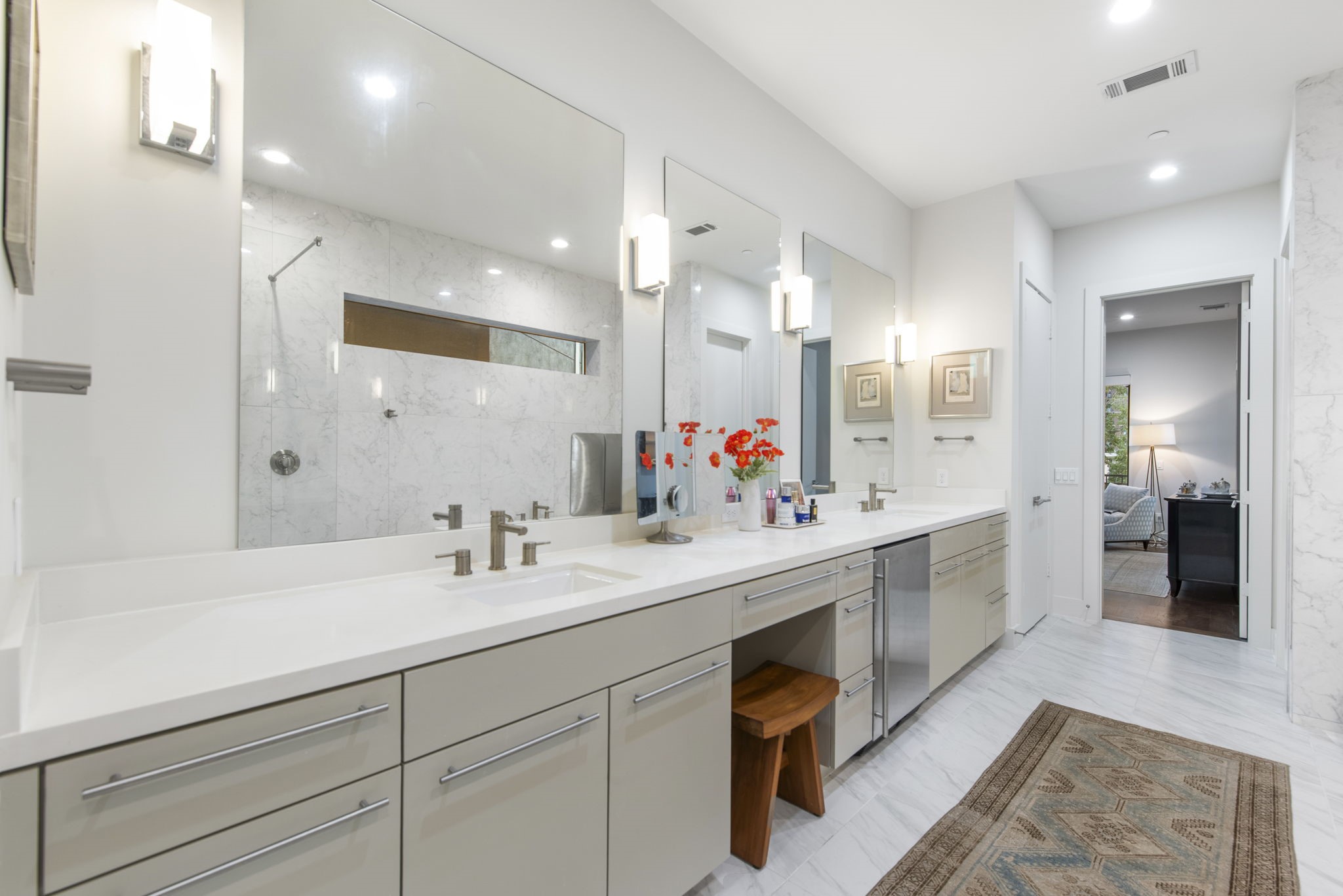 205 Portland Street Houston, TX 77006 - Photo 22 of 36 a spacious bathroom with a sink double vanity granite and a mirror