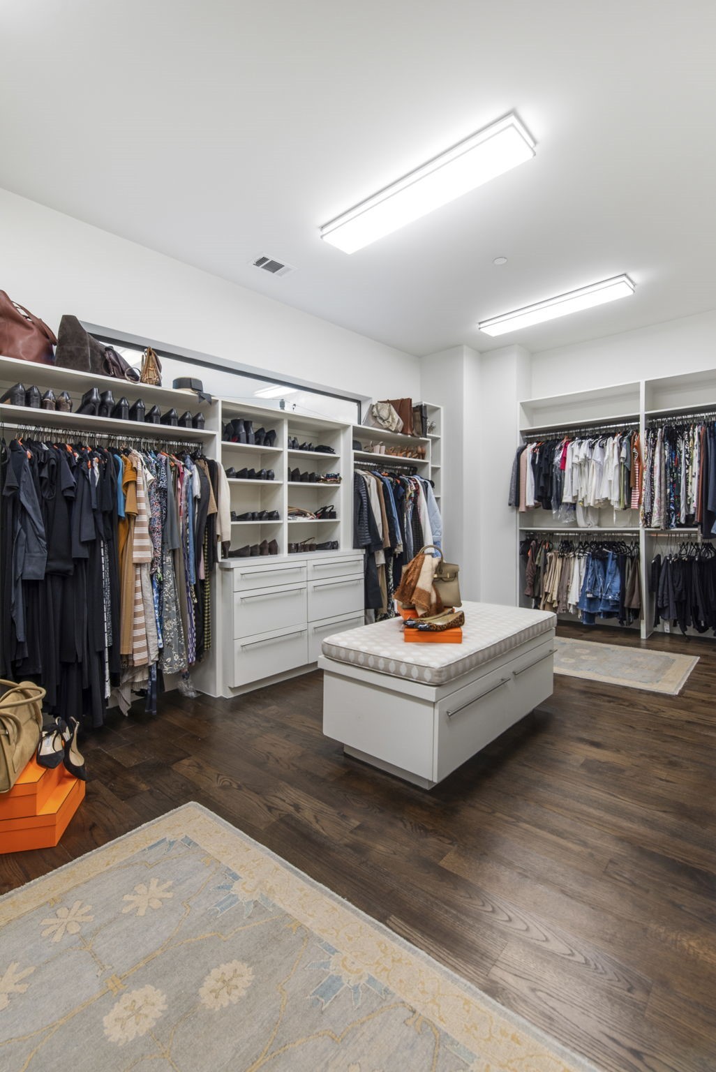 205 Portland Street Houston, TX 77006 - Photo 24 of 36 a living room with lots of furniture and a book shelf