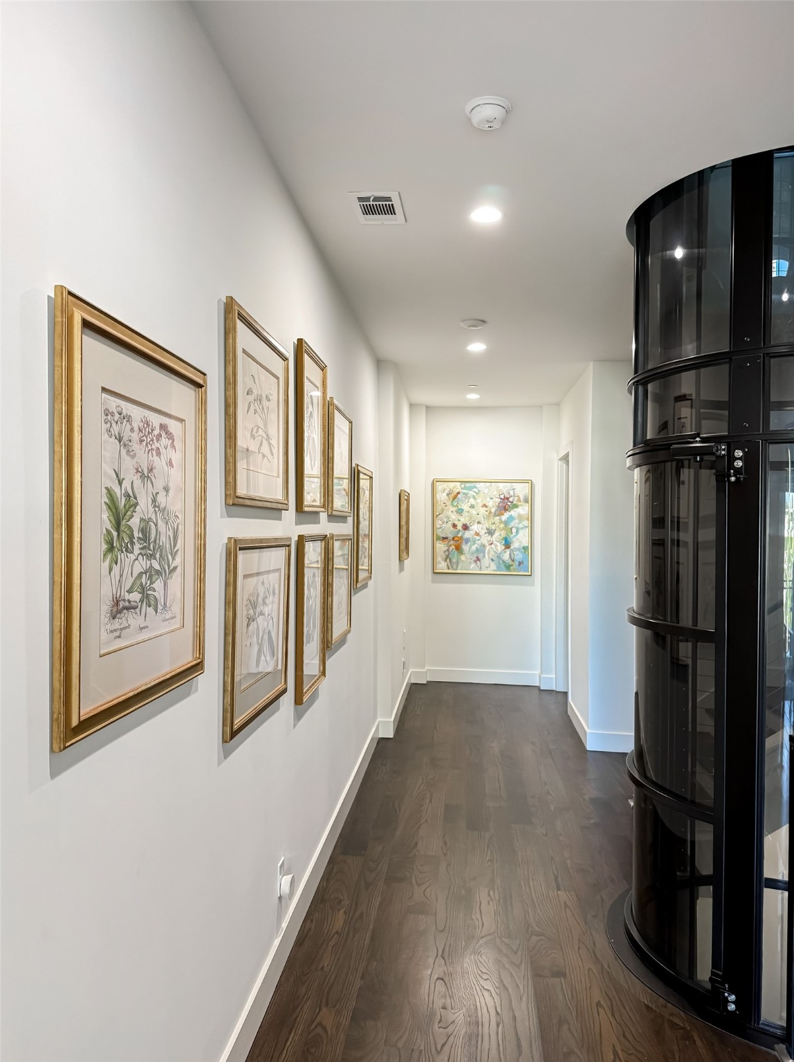 205 Portland Street Houston, TX 77006 - Photo 26 of 36 a view of a hallway with wooden floor