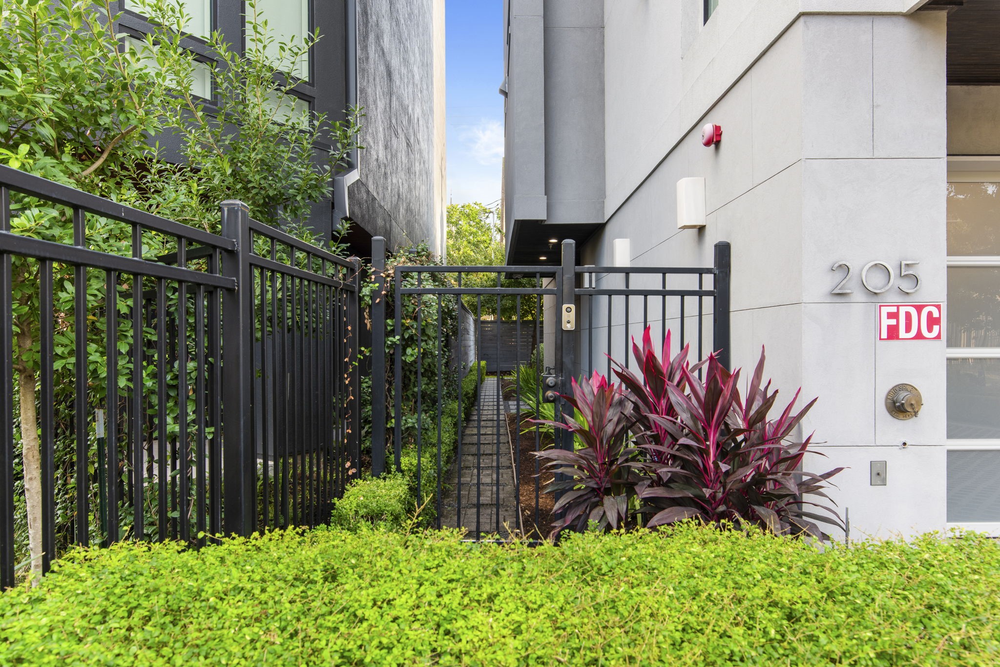 205 Portland Street Houston, TX 77006 - Photo 3 of 36 a view of street along with wooden fence