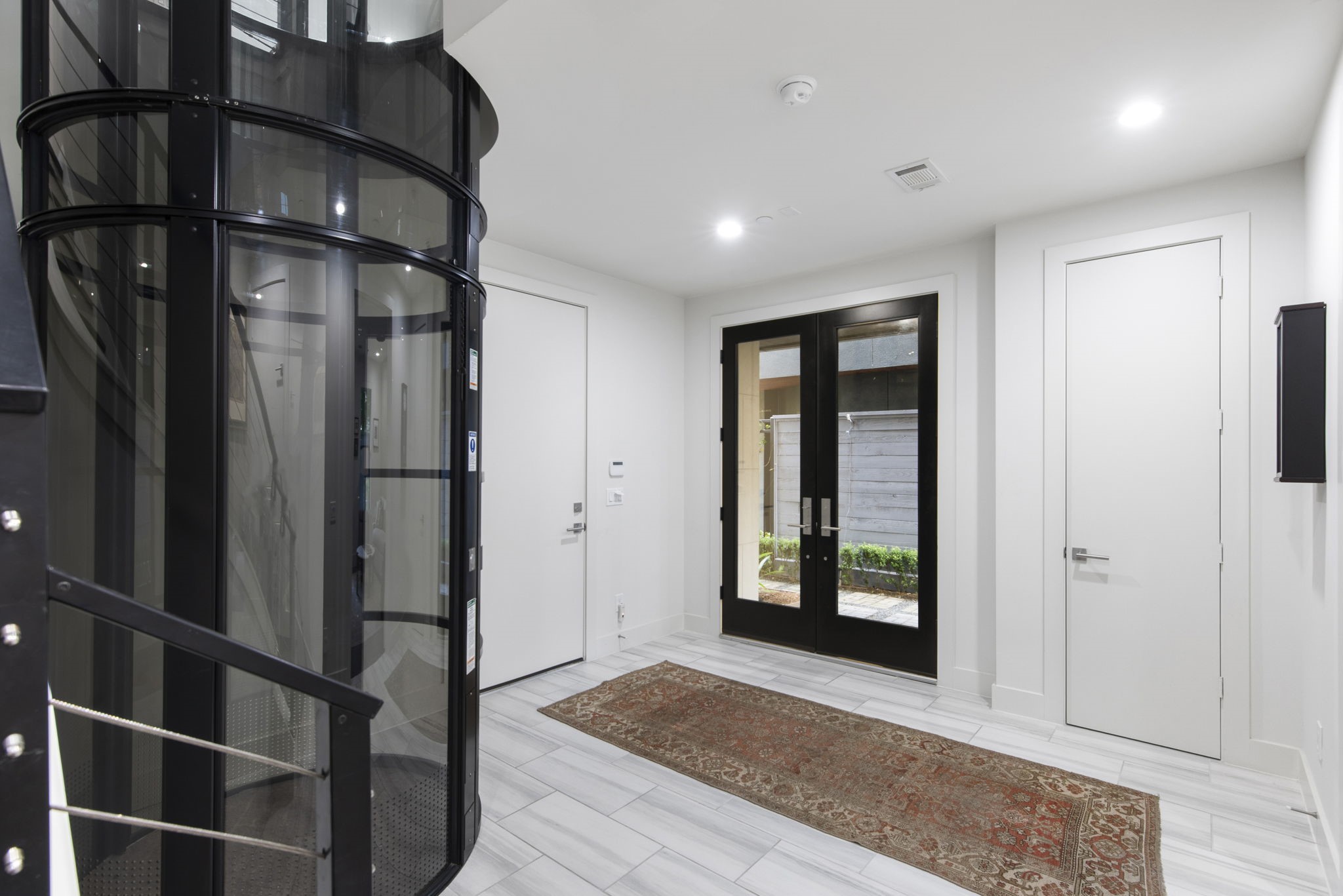 205 Portland Street Houston, TX 77006 - Photo 6 of 36 a view of an entryway with wooden floor