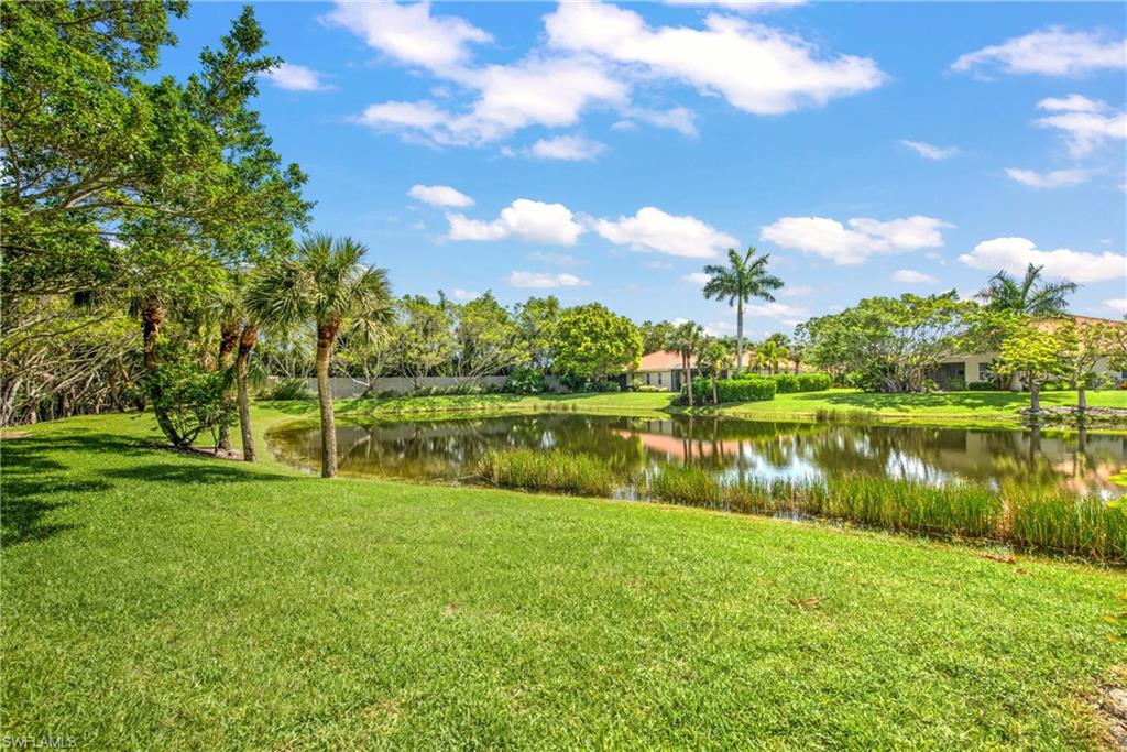 8385 Whisper Trace Way, Unit N104 Naples, FL 34114 - Photo 15 of 16 a view of lake with green space