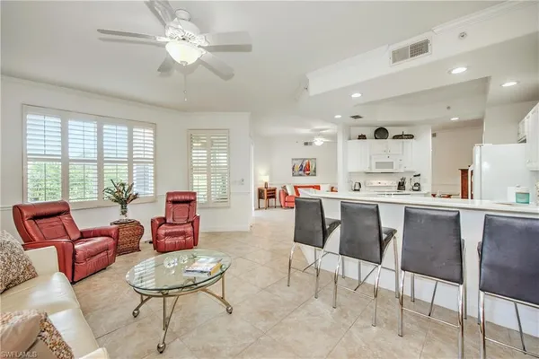 a kitchen a sink a refrigerator and window