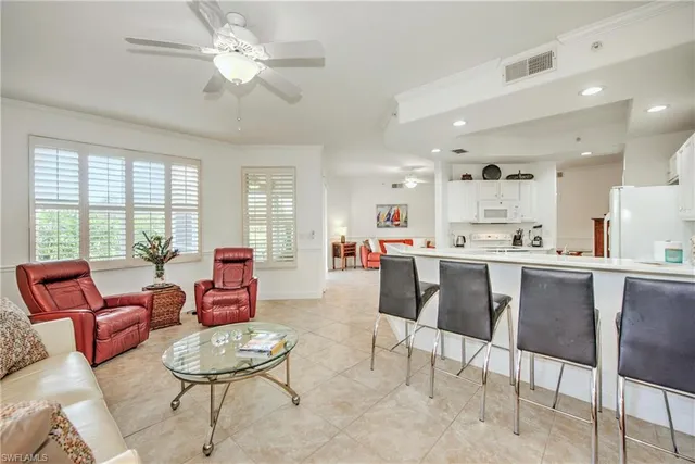 a kitchen a sink a refrigerator and window