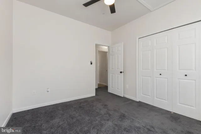 an empty room with fan