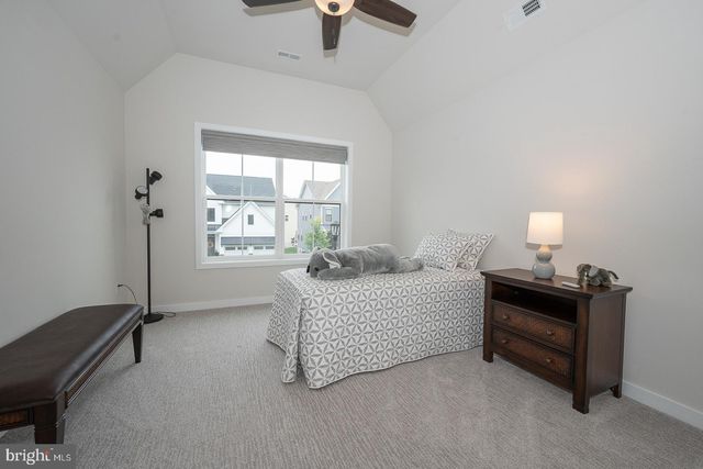 a view of a patio with couches and potted plants