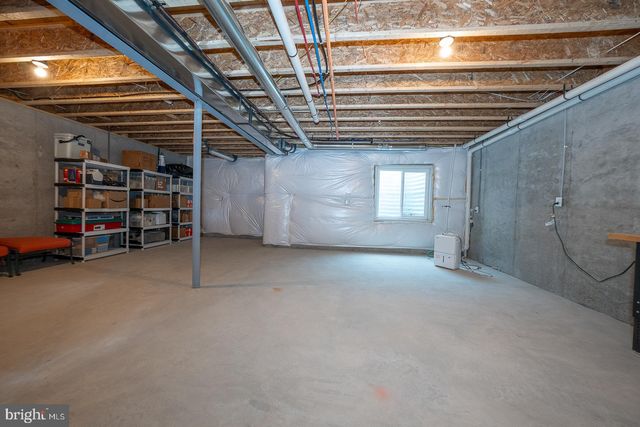 a living room with fireplace furniture and a flat screen tv