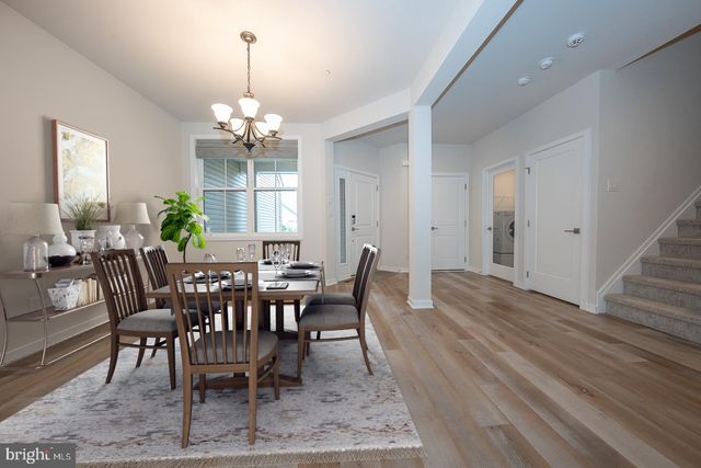 a view of entryway with wooden floor and stairs