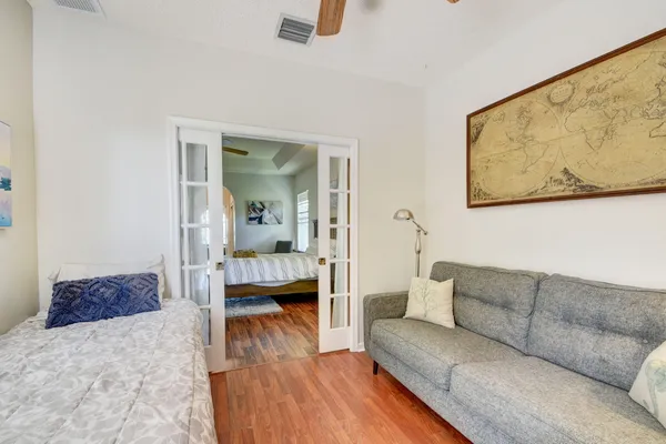 a living room with furniture and wooden floor