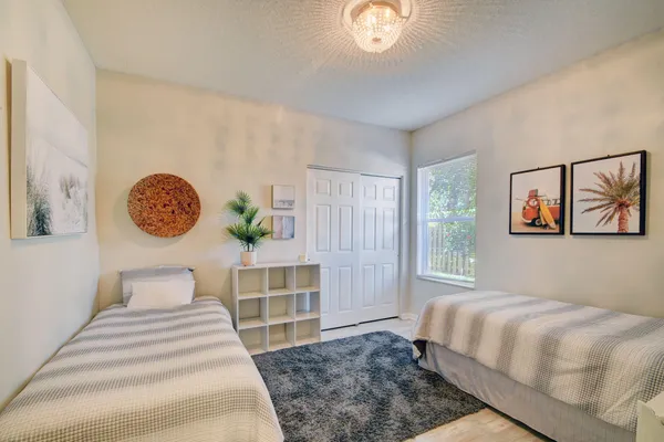 a bedroom with a bed and a window