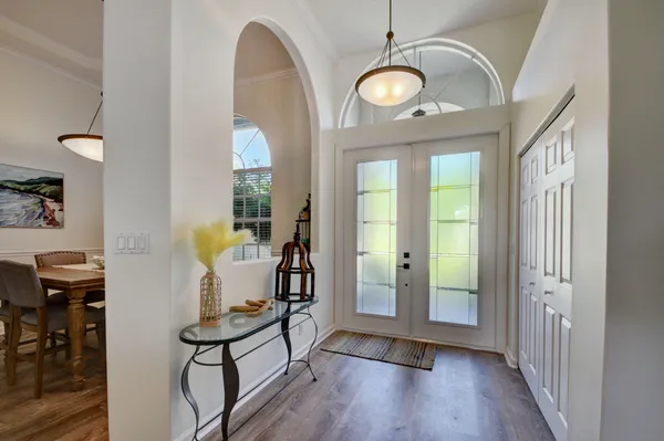 a view of a room with furniture and wooden floor