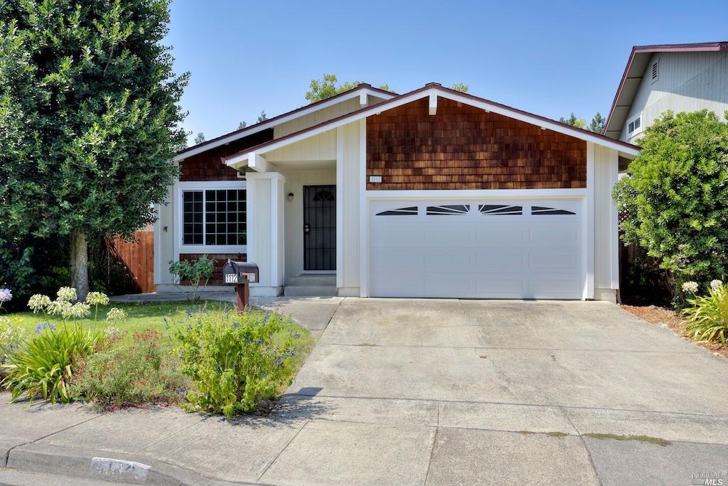 1112 Hailey Court Rohnert Park, CA 94928 - Photo 1 of 1 a view of a house with a small yard and a large tree