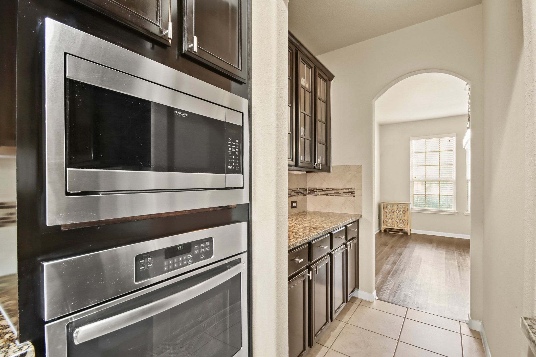 25407 Terrain Park Drive Spring, TX 77373 - Photo 16 of 33 a kitchen with a stove and a microwave