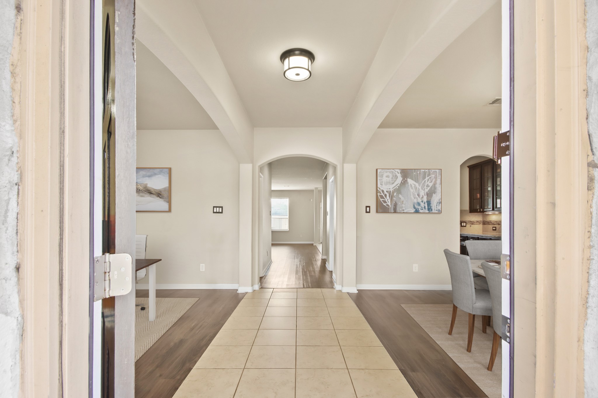 25407 Terrain Park Drive Spring, TX 77373 - Photo 5 of 33 a view of a hallway with wooden floor and a bathroom