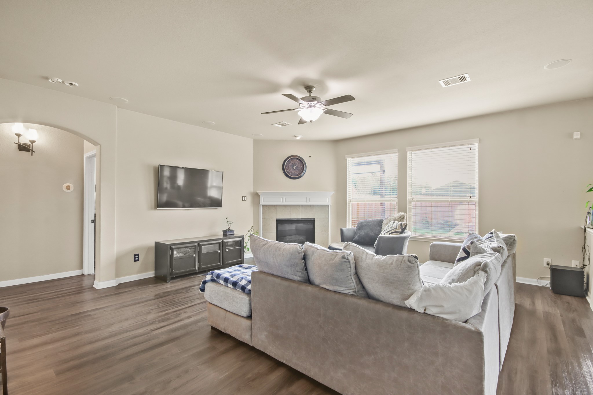 25407 Terrain Park Drive Spring, TX 77373 - Photo 10 of 33 a living room with furniture a fireplace and a large window