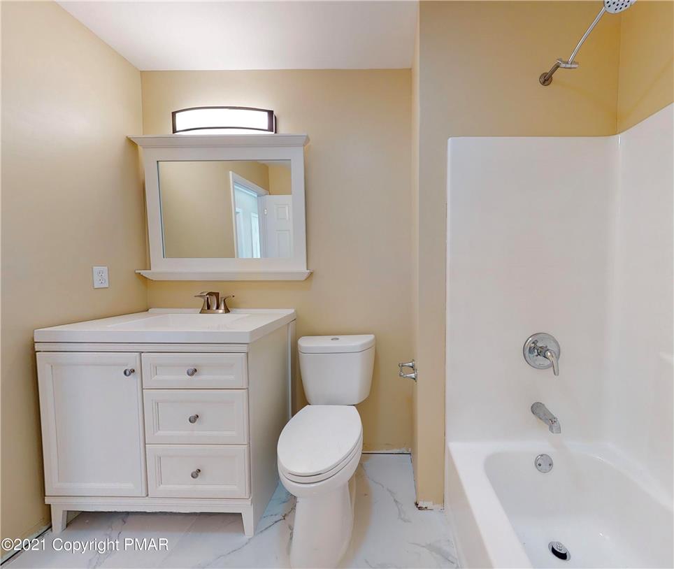 1110 Misty Ridge East Stroudsburg, PA 18302 - Photo 26 of 43 A well-appointed bathroom with a spacious vanity and a combination bathtub and shower.