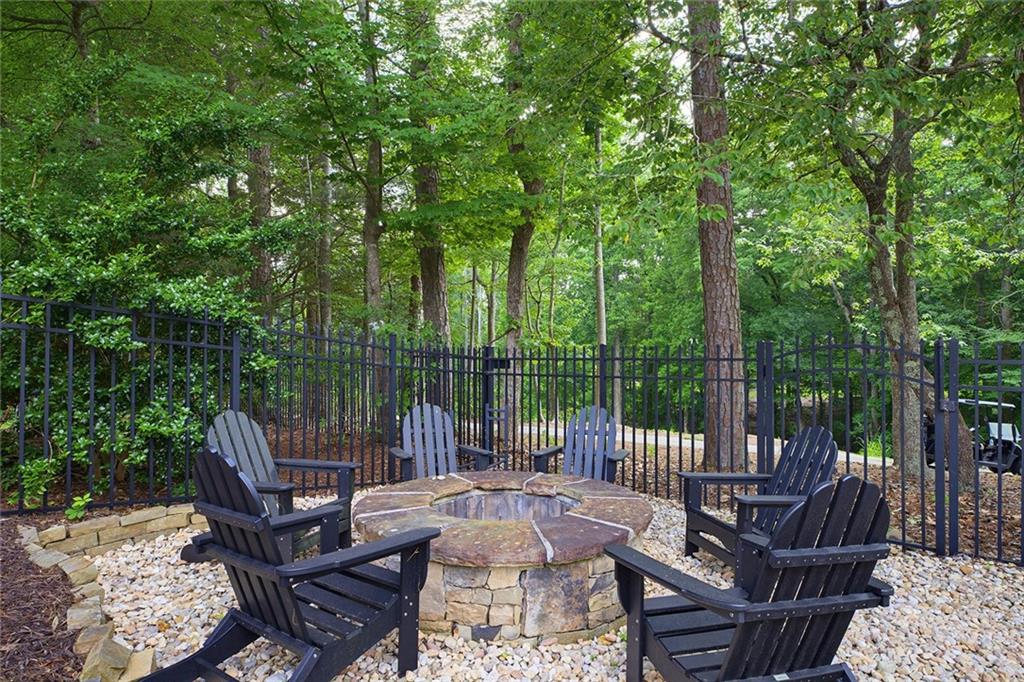 14442 Club Circle Milton, GA 30004 - Photo 63 of 82 a view of a patio with couches chairs and a fire pit