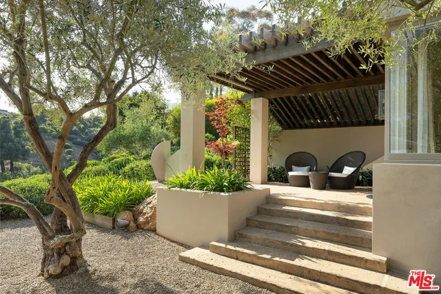 a view of a couches and a fire pit in the patio