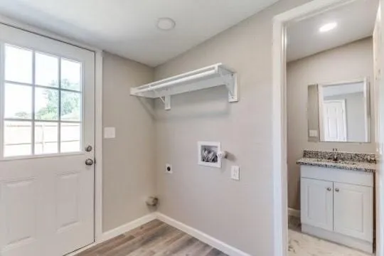 a bathroom with a granite countertop sink a shower and a mirror