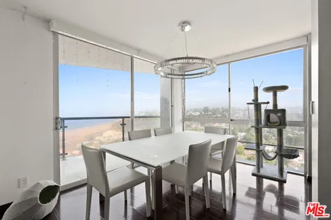 a view of a dining room with furniture window and outside view