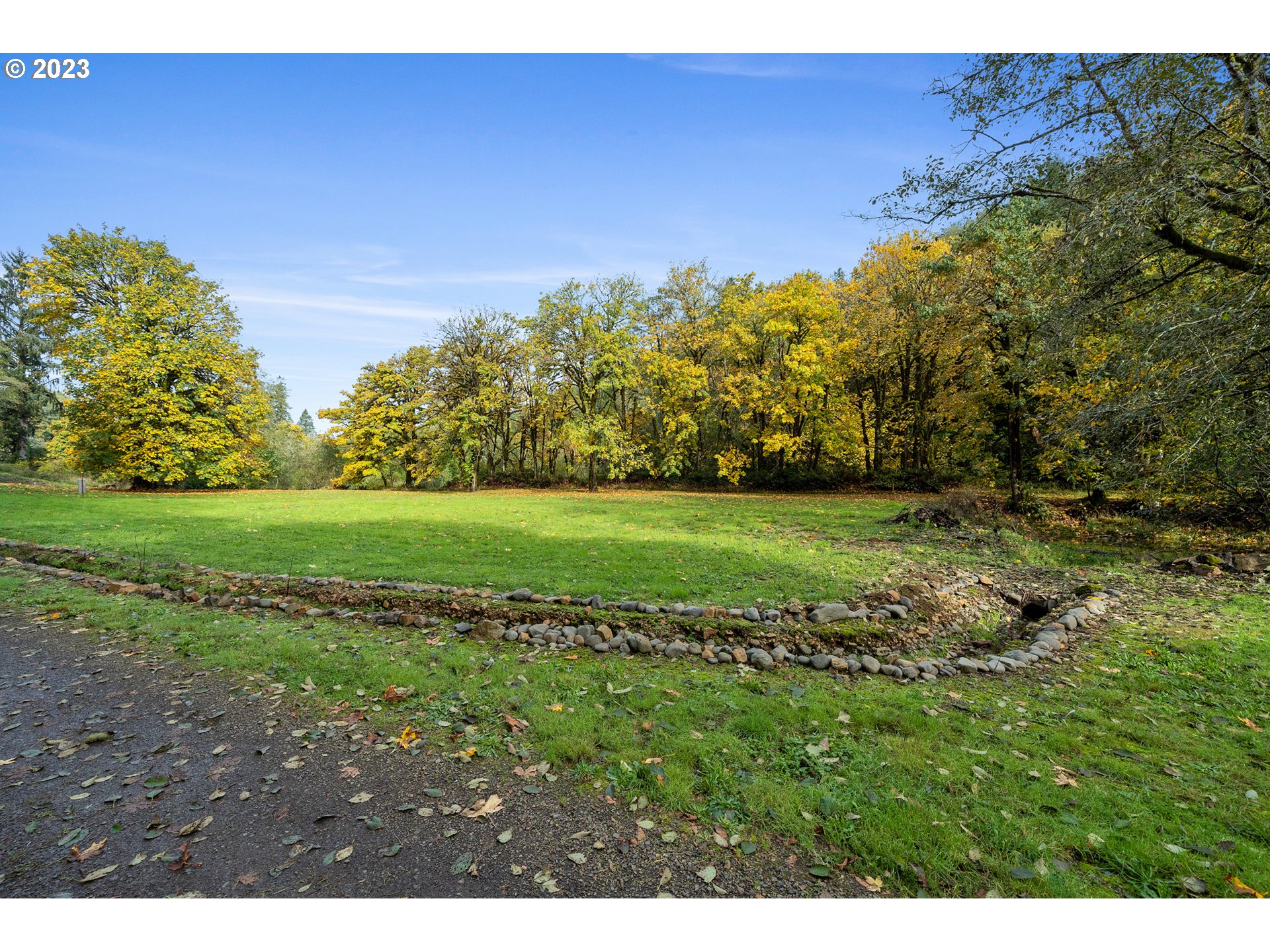 701 Highway 101 South Cloverdale, OR 97112 - Photo 2 of 12 a view of a field of grass and trees