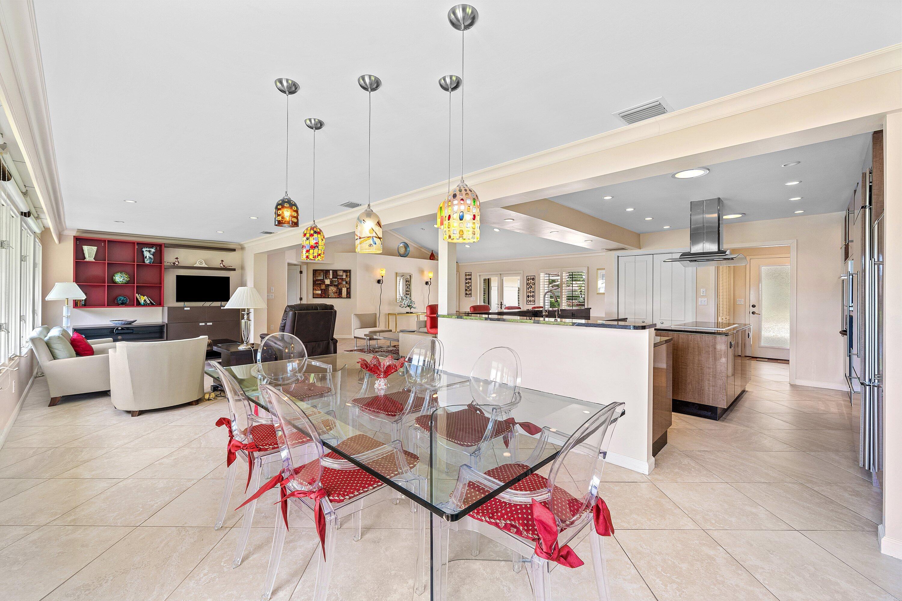4365 Shell Drake Lane Boynton Beach, FL 33436 - Photo 14 of 56 a living room with furniture kitchen view and a chandelier