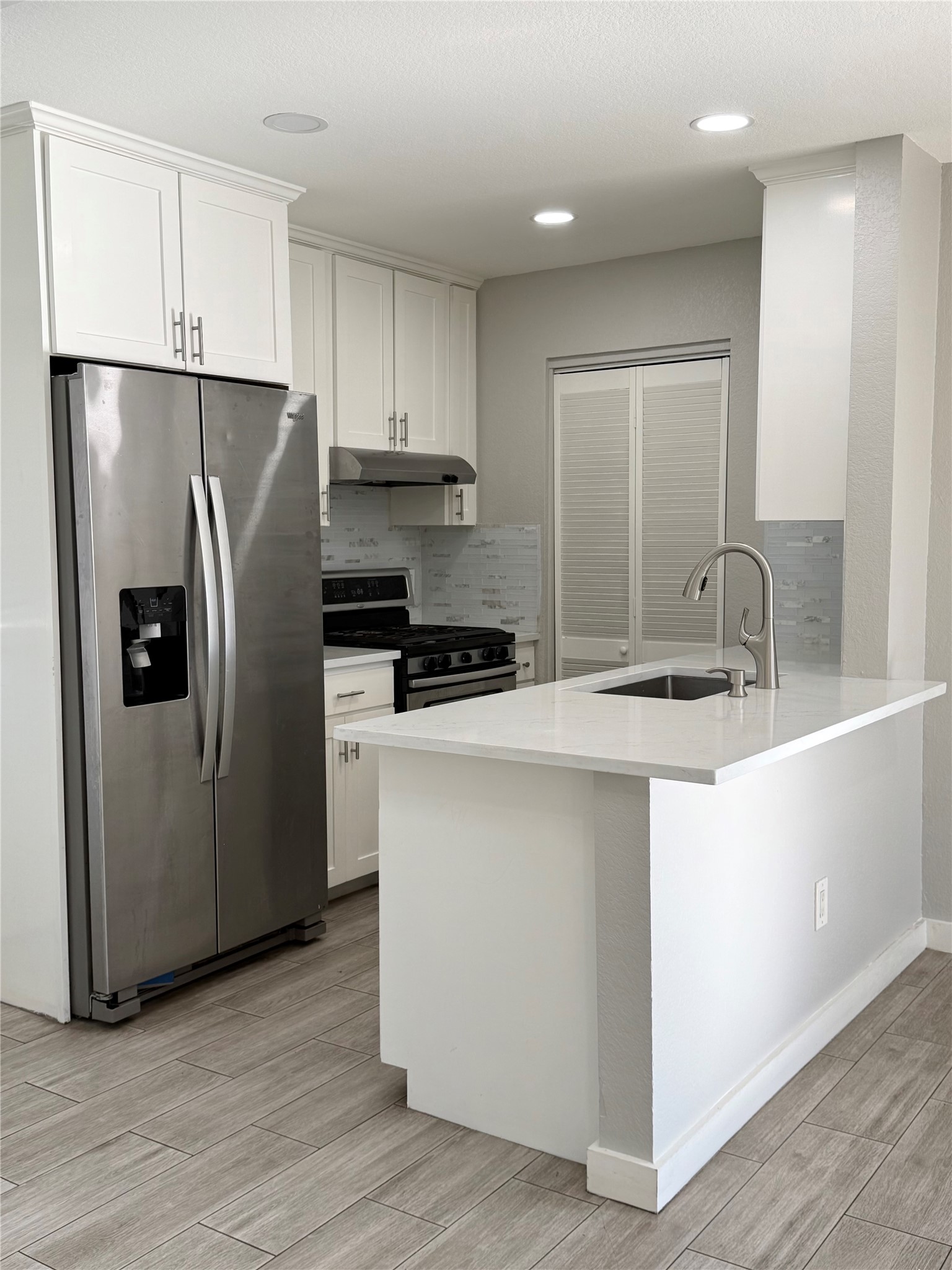 1908 Bradmore Drive Round Rock, TX 78664 - Photo 2 of 15 a kitchen with stainless steel appliances a refrigerator sink and microwave