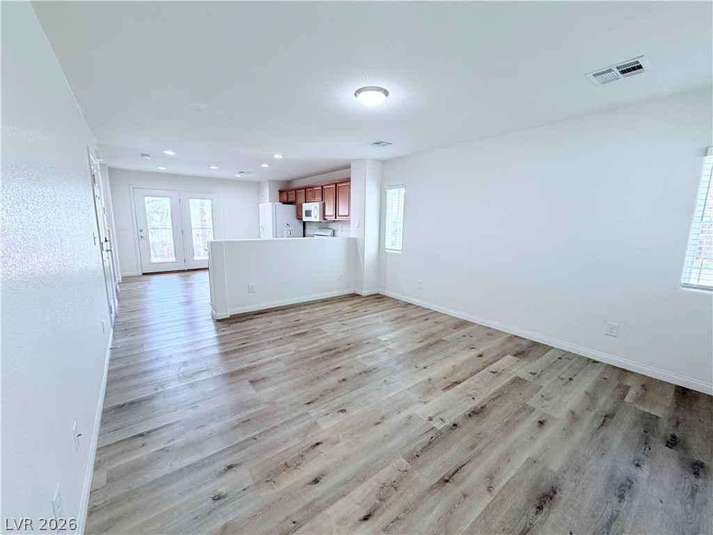 3610 Wireless Court Las Vegas, NV 89129 - Photo 15 of 15 An open floorplan seamlessly connects the living area to the kitchen, promoting effortless flow and interaction.