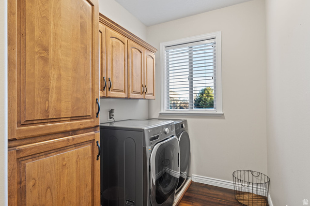 6208 West Bull River Road Highland, UT 84003 - Photo 45 of 90 Dedicated laundry space featuring wood-finish flooring, ample storage with upper and pantry-style cabinetry, and a window for natural light