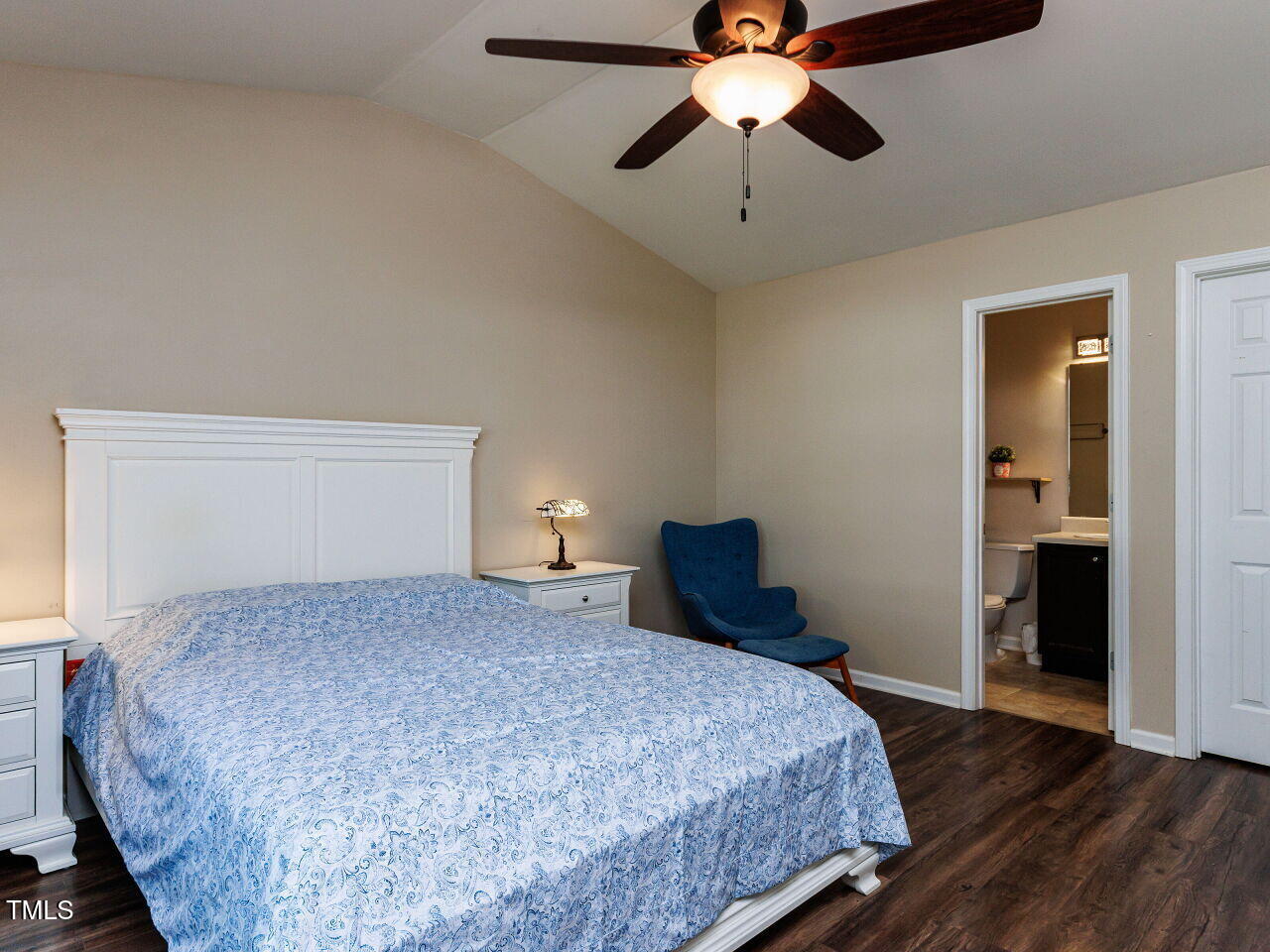 3665 Watkins Ridge Court Raleigh, NC 27616 - Photo 12 of 28 a bedroom with a bed and a chandelier