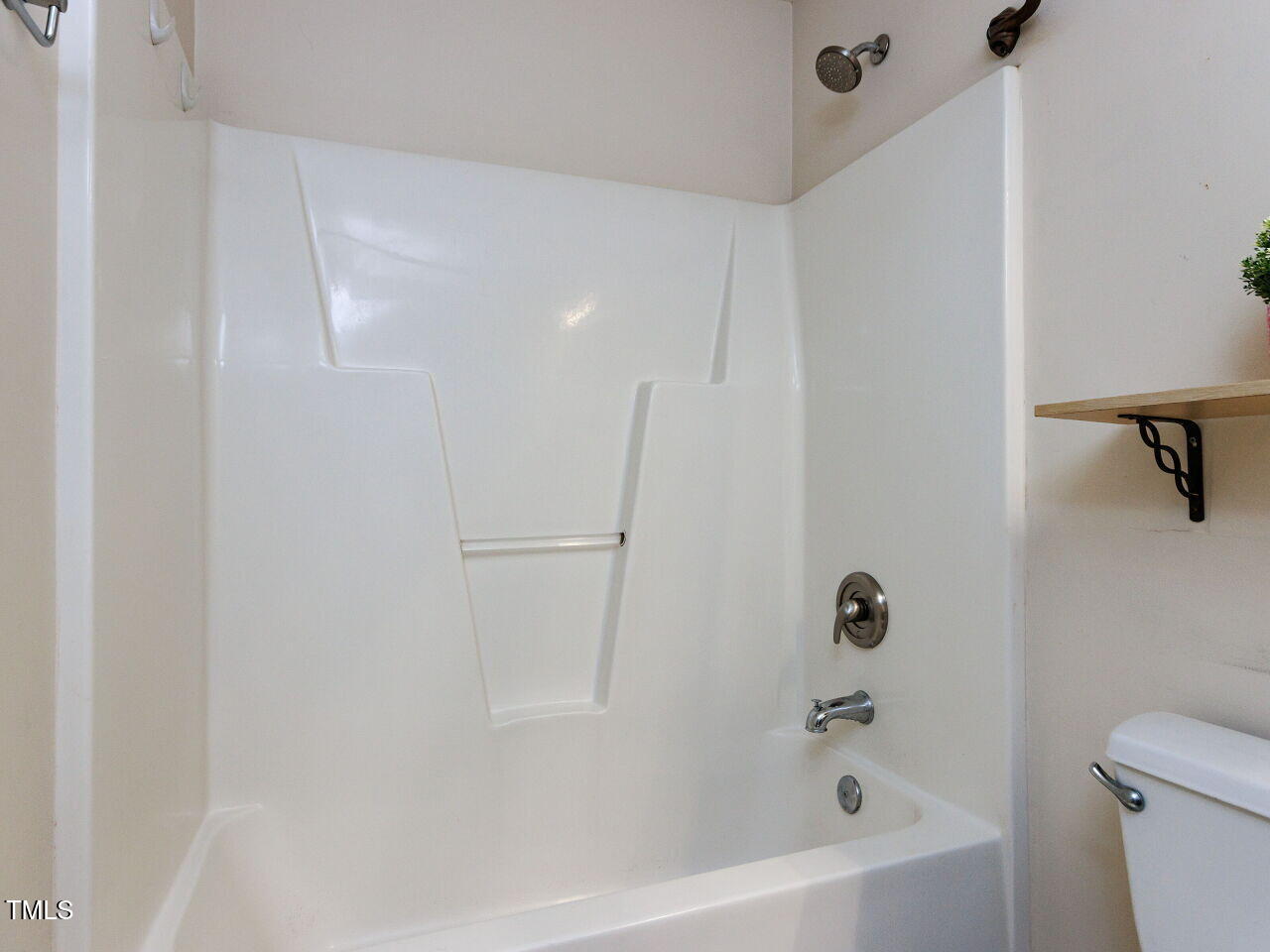 3665 Watkins Ridge Court Raleigh, NC 27616 - Photo 15 of 28 a bathroom with a bathtub and shower
