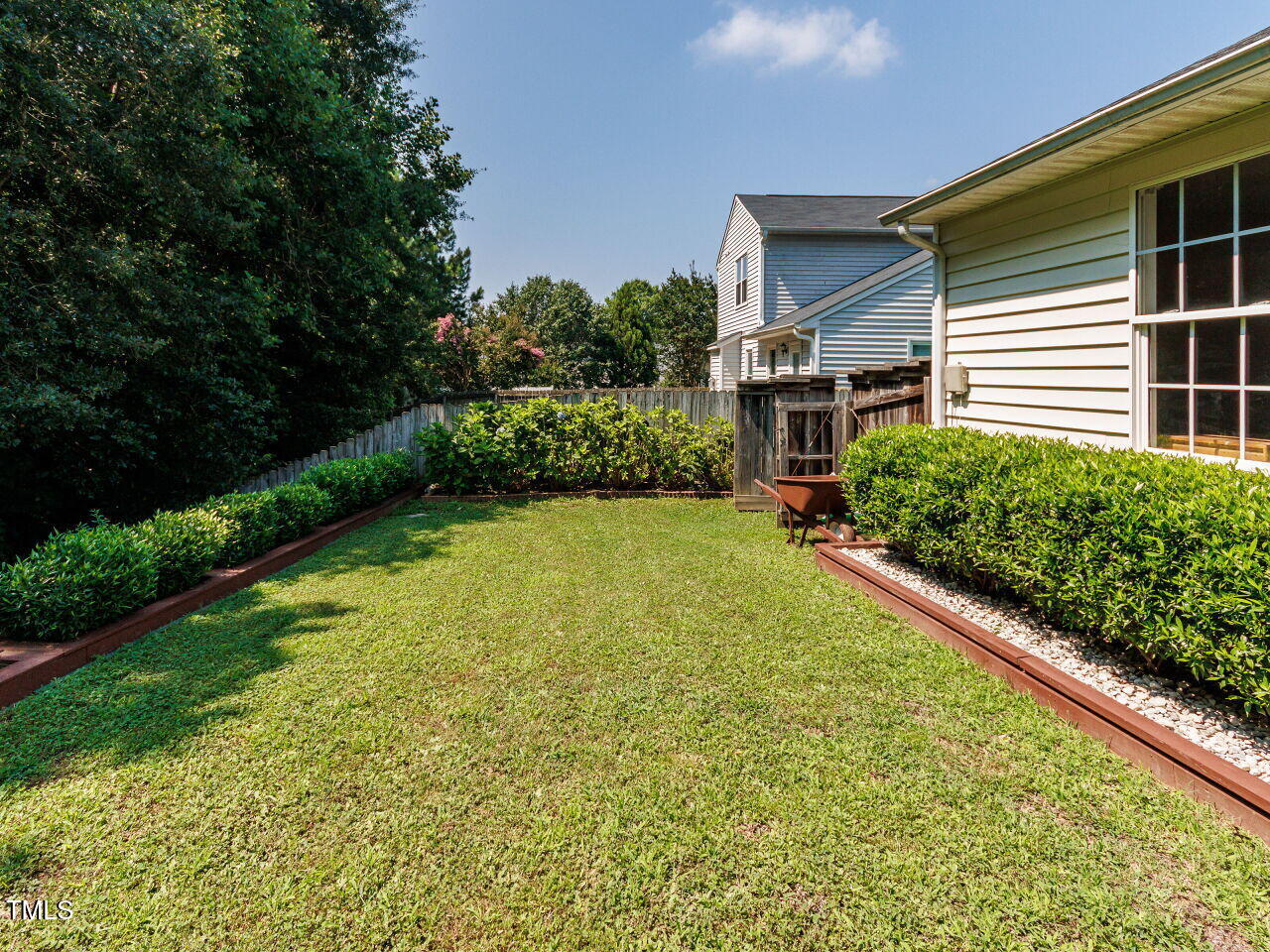 3665 Watkins Ridge Court Raleigh, NC 27616 - Photo 25 of 28 a view of a backyard with plants