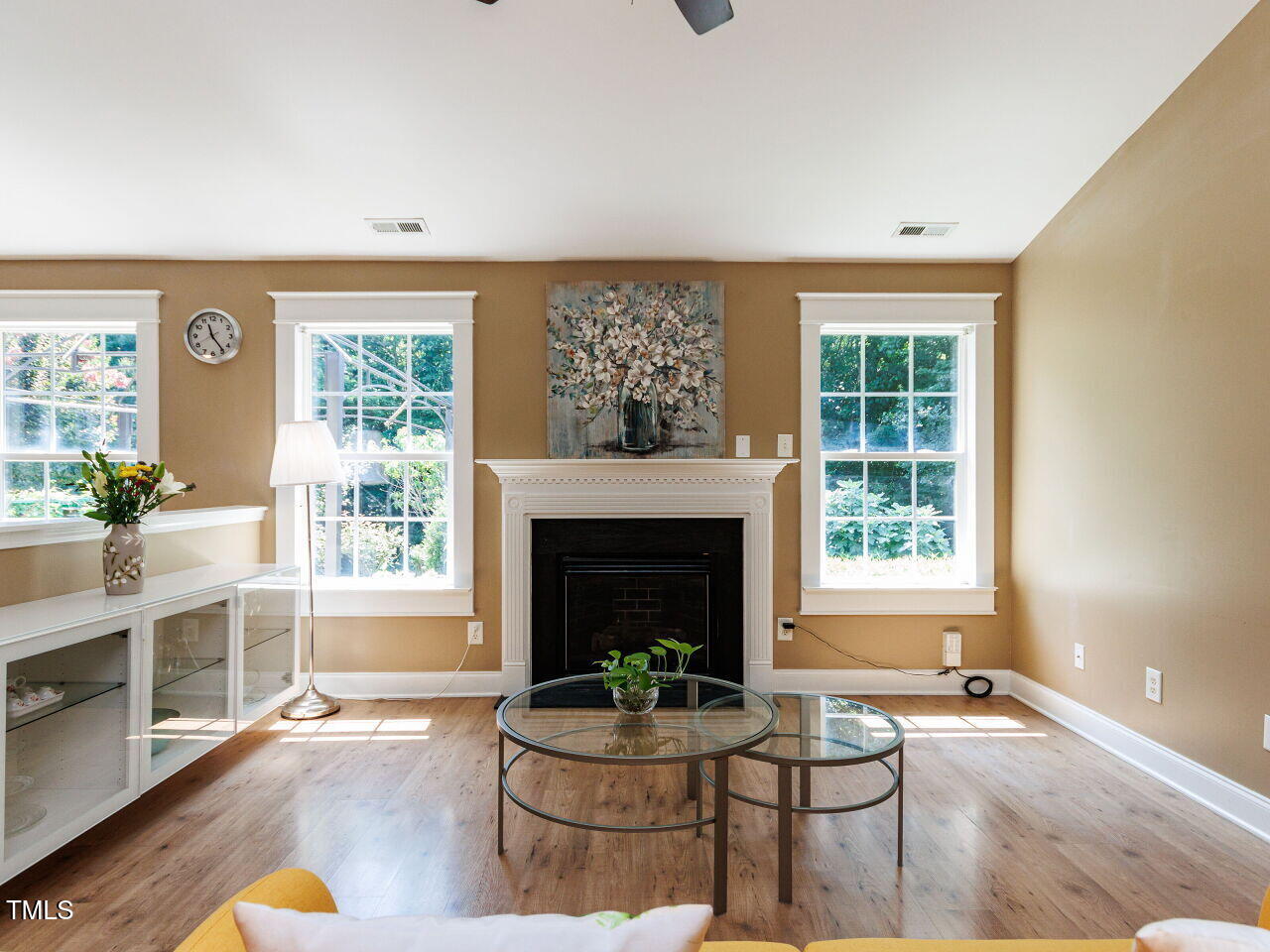 3665 Watkins Ridge Court Raleigh, NC 27616 - Photo 3 of 28 a living room with furniture a fireplace and a large window