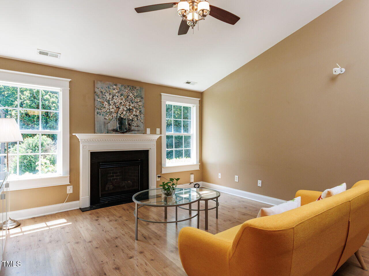 3665 Watkins Ridge Court Raleigh, NC 27616 - Photo 4 of 28 a living room with furniture and a fireplace