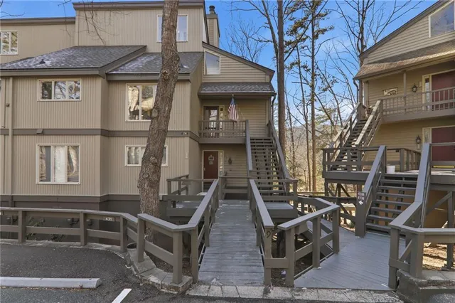 a front view of a house with outdoor space