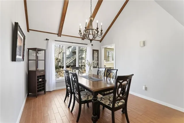 a view of a dining room with furniture and window