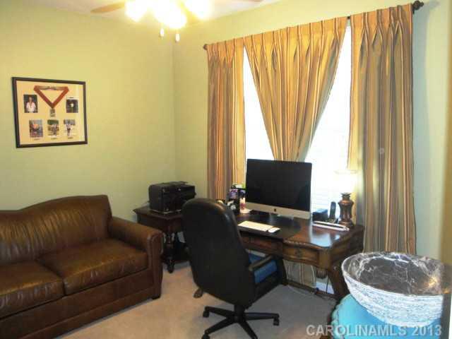 668 6th Baxter Crossing, Unit 111 Fort Mill, SC 29708 - Photo 14 of 16 a view of a livingroom with workspace and a couch