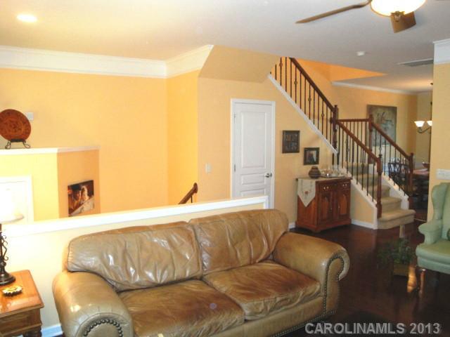 668 6th Baxter Crossing, Unit 111 Fort Mill, SC 29708 - Photo 4 of 16 a living room with furniture and stairs