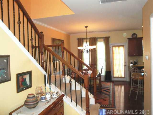 668 6th Baxter Crossing, Unit 111 Fort Mill, SC 29708 - Photo 5 of 16 a view of entryway and hall with wooden floor