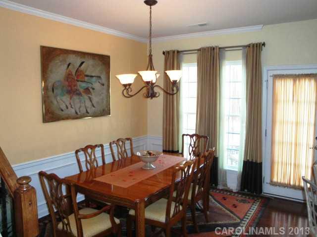 668 6th Baxter Crossing, Unit 111 Fort Mill, SC 29708 - Photo 6 of 16 a view of a dining room with furniture window and outside view