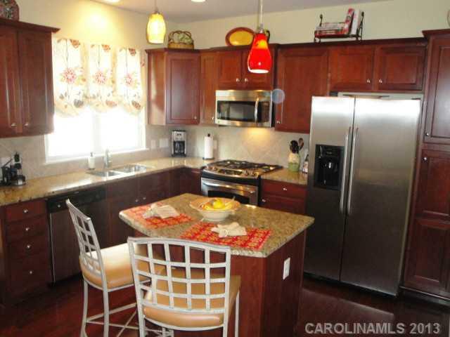 668 6th Baxter Crossing, Unit 111 Fort Mill, SC 29708 - Photo 9 of 16 a kitchen with a sink cabinets and appliances