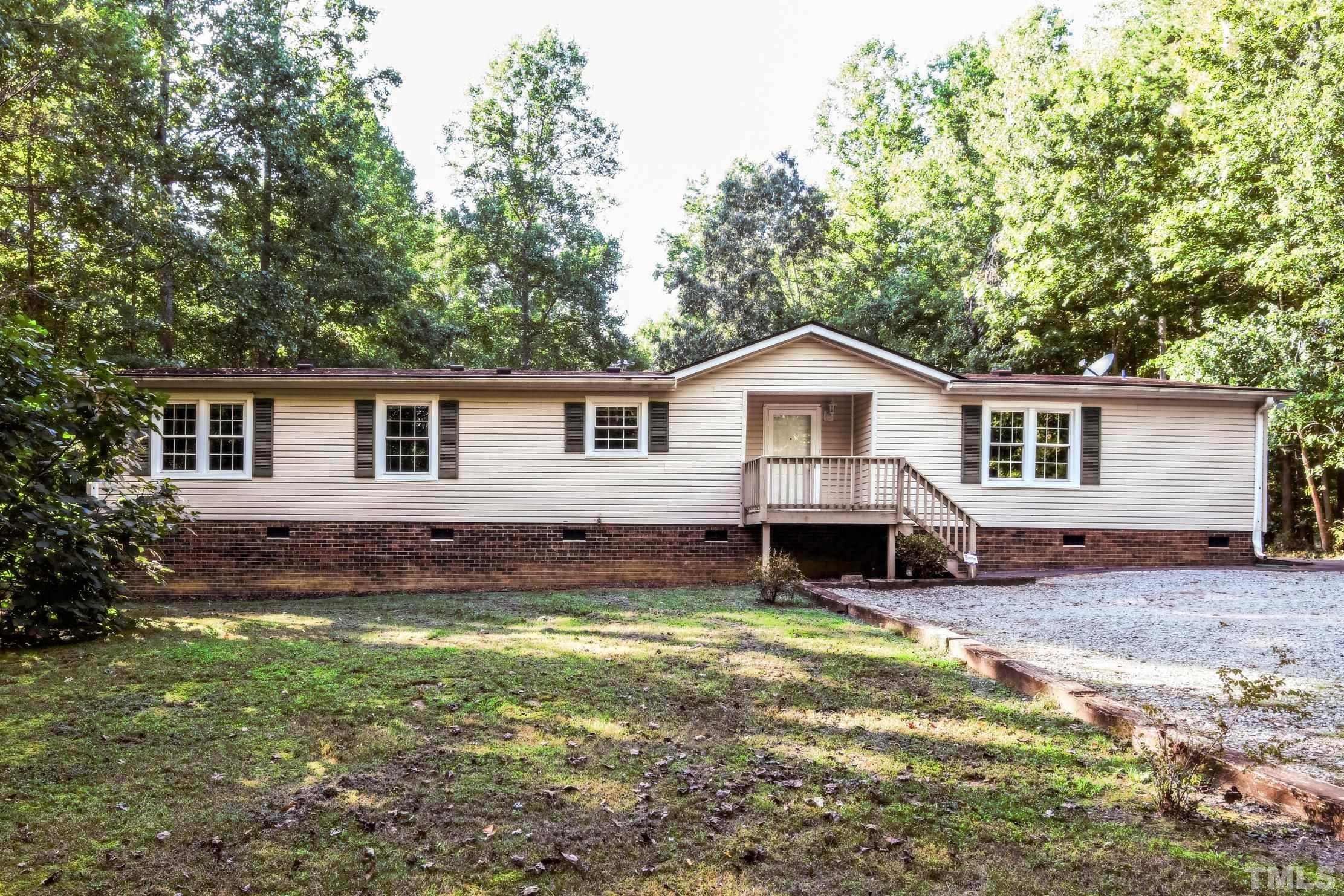 1516 Bill Poole Road Rougemont, NC 27572 - Photo 1 of 17 a view of a house with a yard and chairs